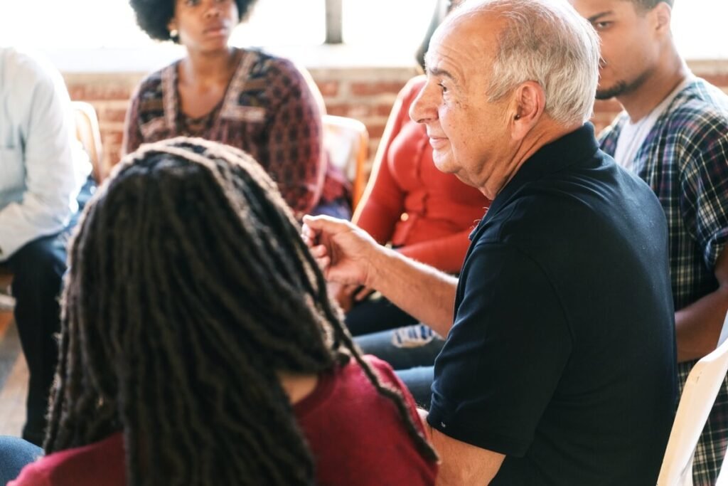 Man speaks during support group.