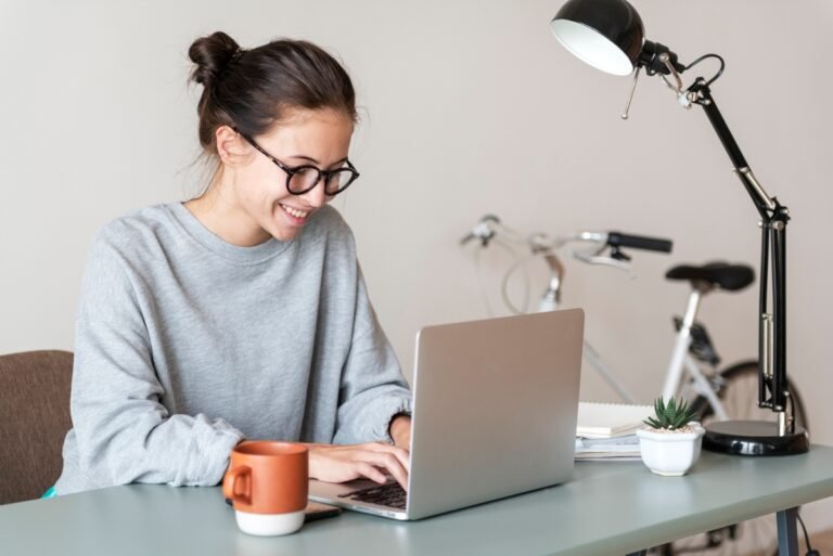 Young woman researching benefits programs online