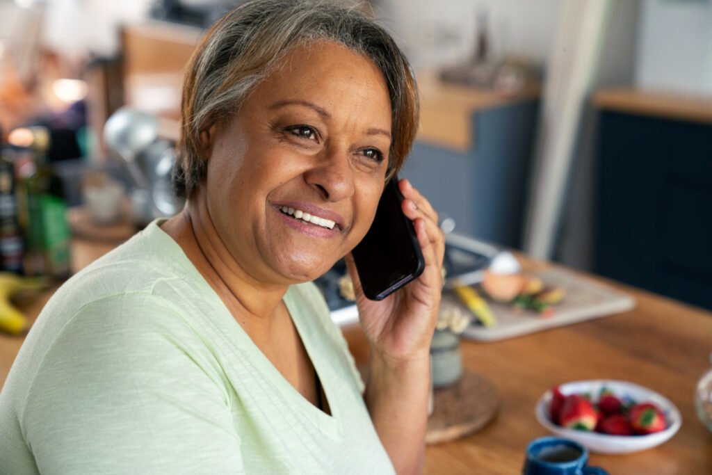 Senior on phone with relative.