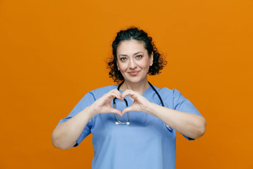 Nurse makes heart sign