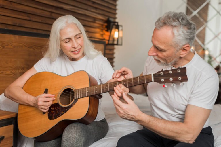 senior-woman-learning-to-play-guitar