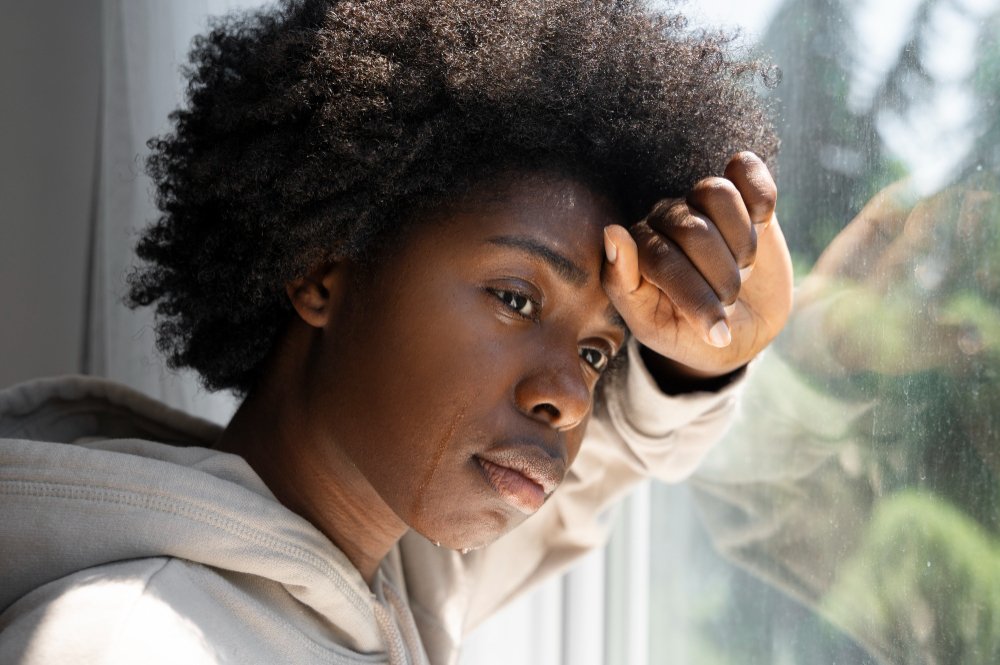 Lonely female caregiver sheds tear