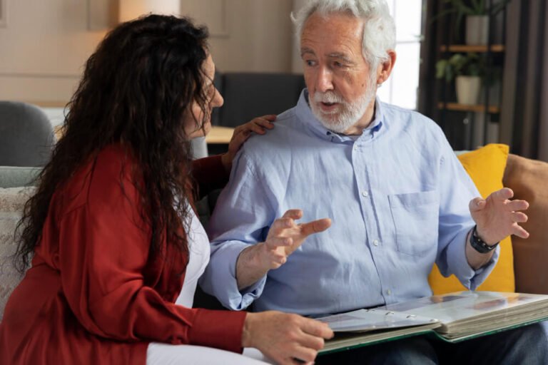 Family caregiver talks to aging parent.