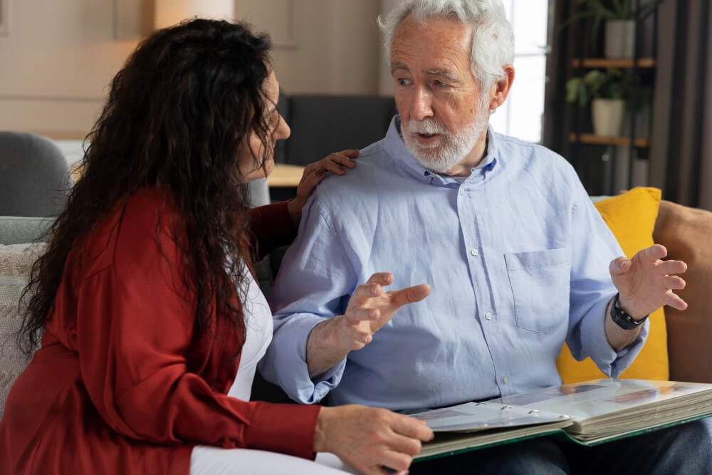 Family caregiver talks to aging parent.