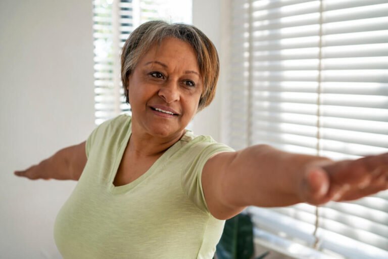 Senior woman caregiver stretches