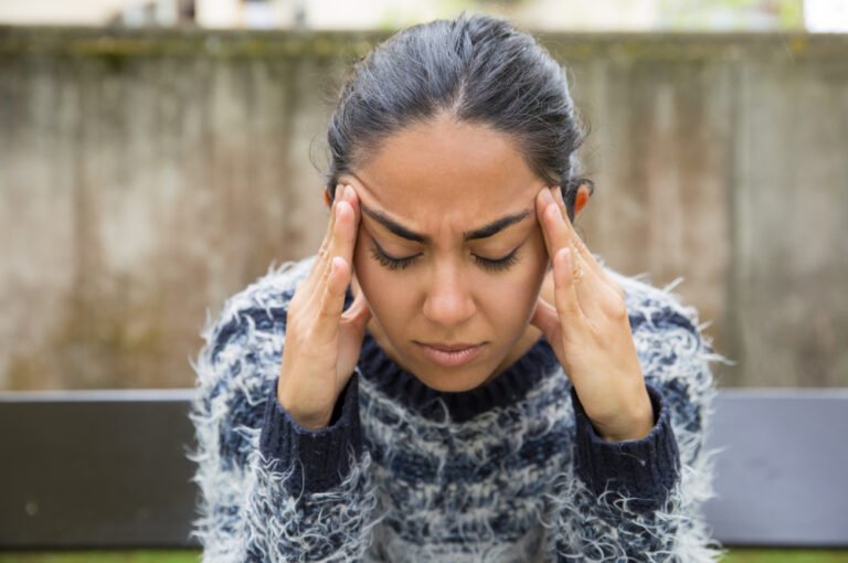 Young female caregiver feels stressed
