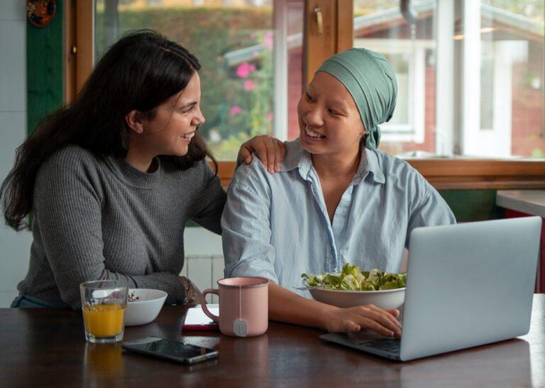 Female family caregiver chats with loved one