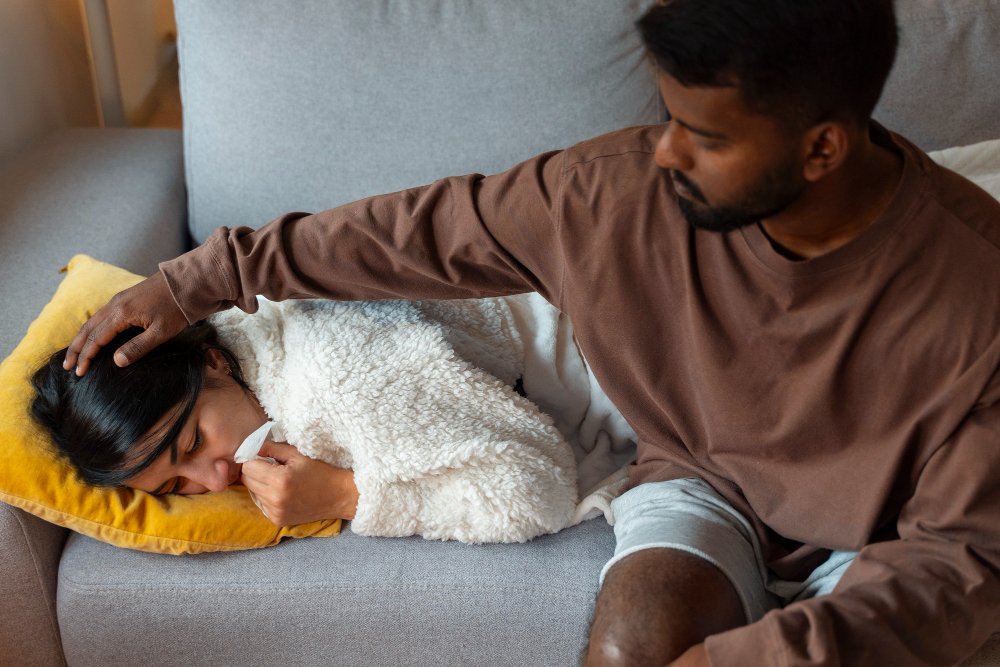 Male family caregiver comforts anxious female relative