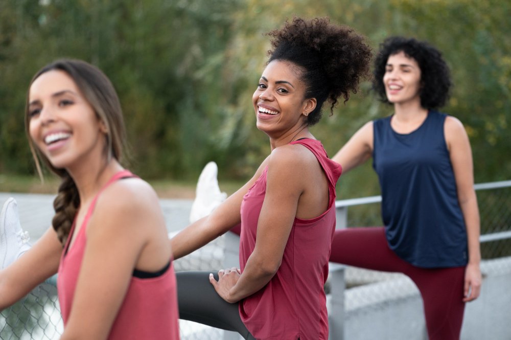Young women perform stretches to relieve stress