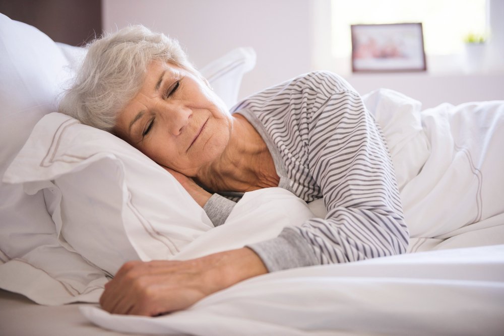 Senior caregiver sleeps peacefully