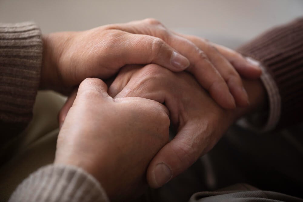 Close-up of senior couple holding hands