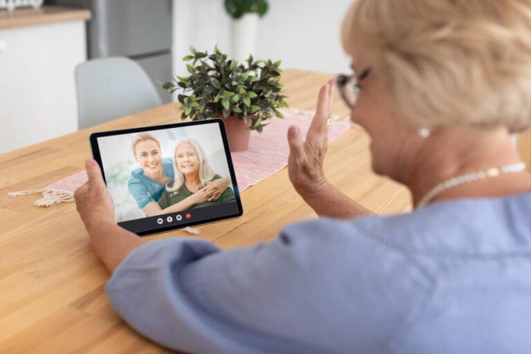 Senior woman enjoys video call with family