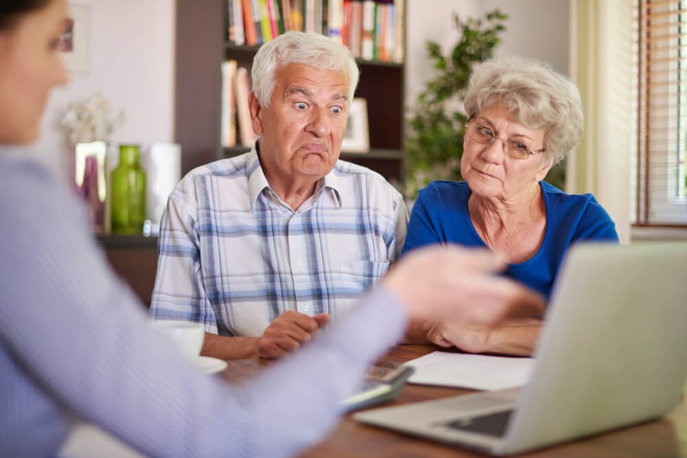 woman explains emergency plan to unconvinced senior couple