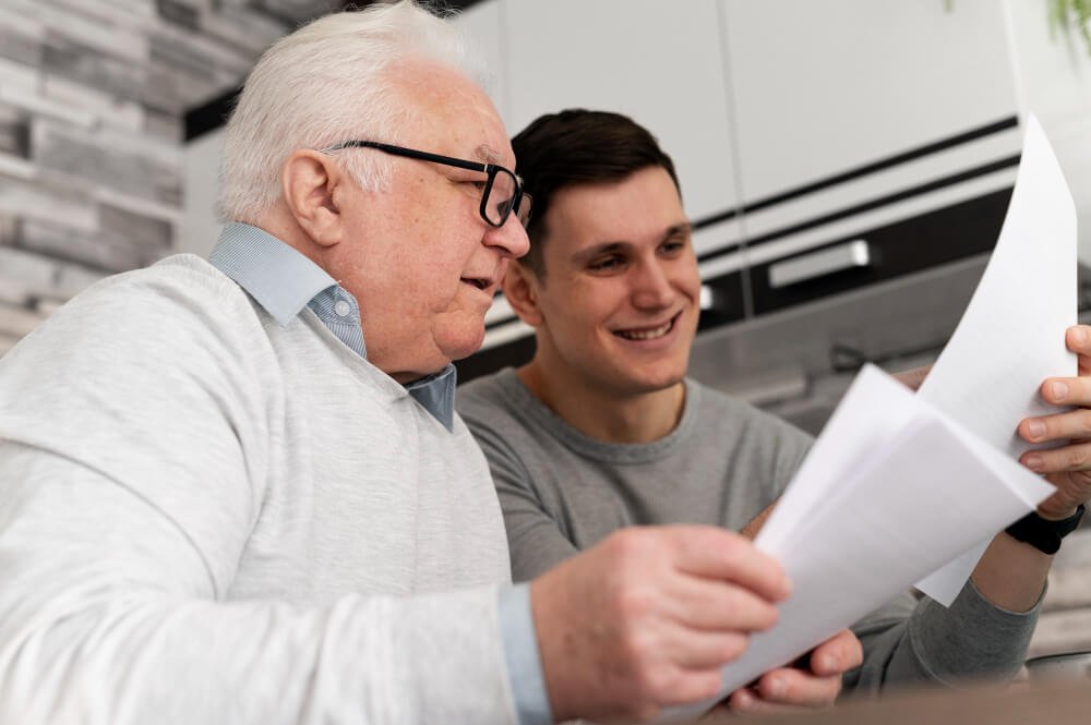 young man reviews emergency plan with senior man