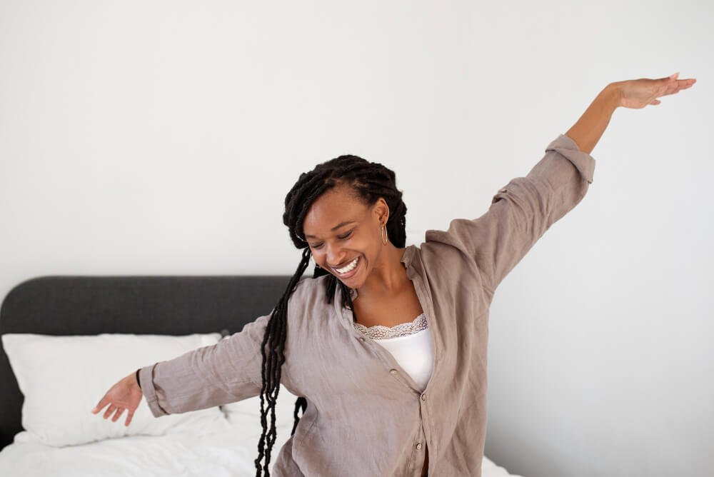 rested young woman stretches in the morning