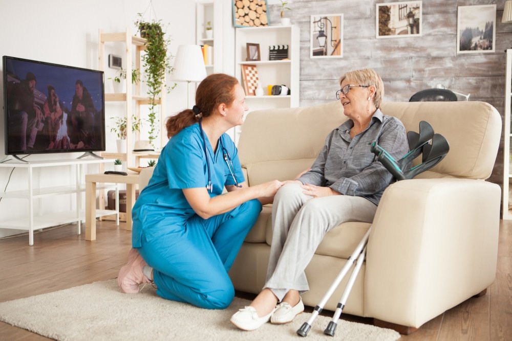 nurse cares for patient in nursing home