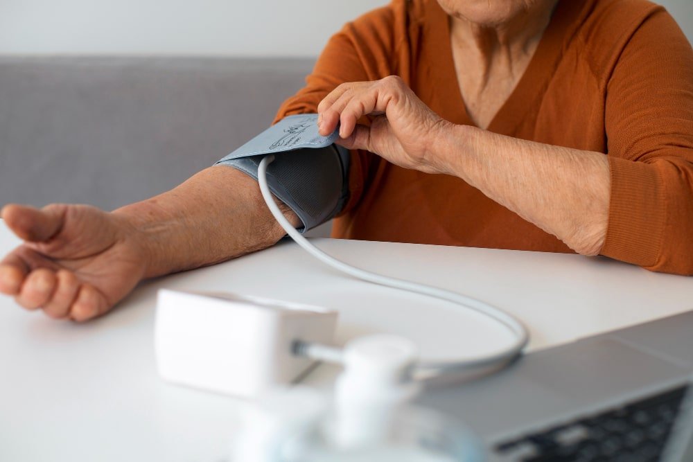 senior woman checks her blood pressure