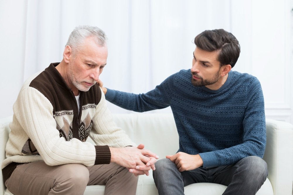 adult son talks to resistant father