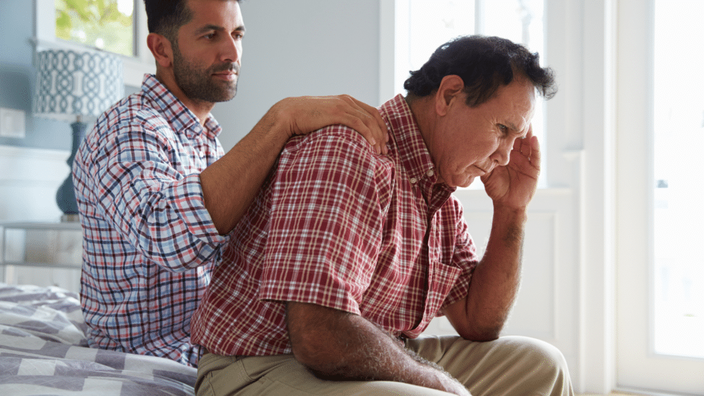 man with dementia gets comfort from his son